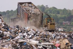 Photo of trash being dumped into a landfill