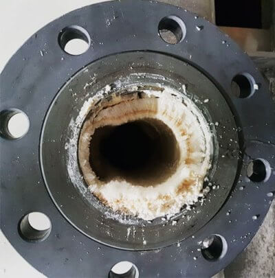 Photo of scaling found on the interior surface of pipes