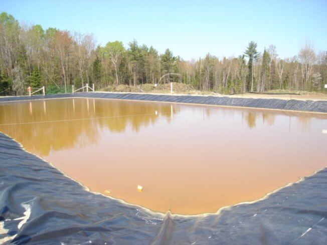 Photo of an evaporation pond as used in the management and processing of landfill leachate