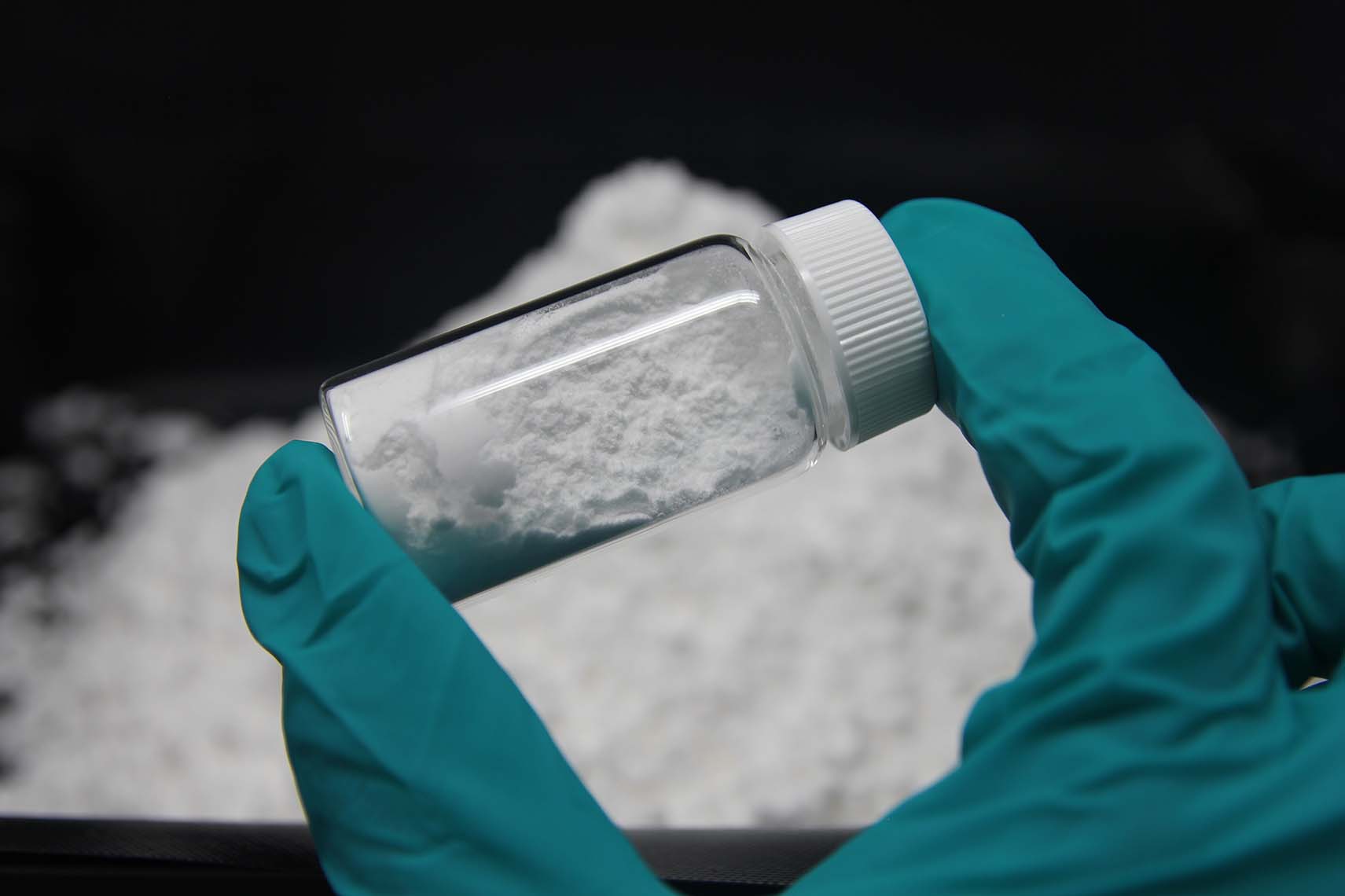 Photo of a vial of battery-grade lithium carbonate produced by Saltworks