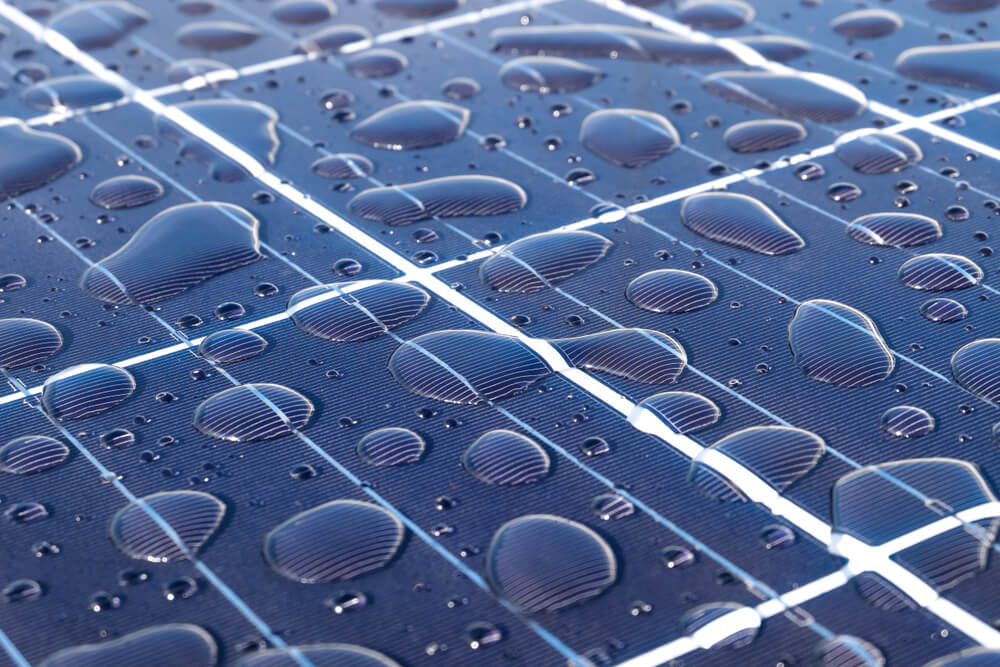 Photo of a solar panel with raindrops covering its surface