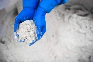 Saltworks employee holding ZLD salts in-hand from a ZLD system