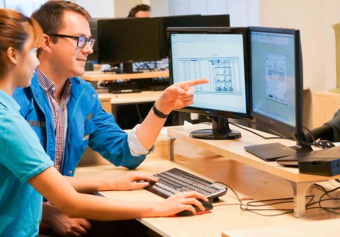 Two Saltworks engineers working at a desk.
