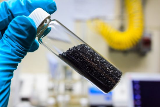 Photo of solid activated carbon powder as used in phenol treatment